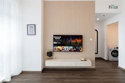 a living room with a tv on a wall at 77 Floor Luxury 1Br Marina Sea View Balcony in Dubai