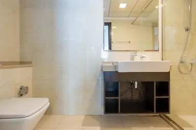 a bathroom with a sink and a toilet at Urban Haven - Peaceful Sanctuary - City Loft in Dubai