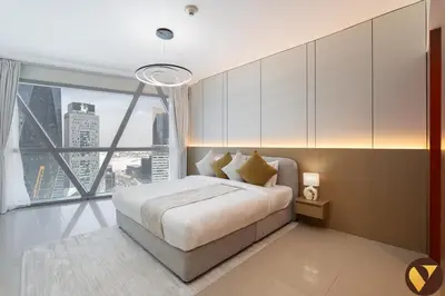 a bedroom with a large bed and a large window at Vogue DIFC Damac Park Tower near Museum of The Future, One Bedroom Apartment with Balcony, City Skyline and Museum of The Future View, Access to all Amenities in Dubai