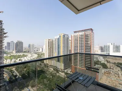 a view of a city with tall buildings at Warm Glow Retreat Cozy Studio In Regina JVC in Dubai