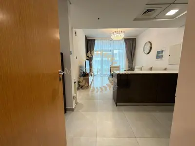a room with a kitchen and a living room at Luxurious Two-Bedroom & Living Room Apartment in Dubai