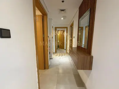 a hallway of a house with a hallwayngth at Luxurious Two-Bedroom & Living Room Apartment in Dubai