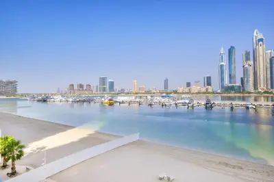 a large body of water with boats in a city at Vacationer l Modern 1 Bed l Private Beach l Pool, Gym Access in Dubai