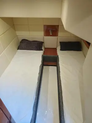 a pair of beds in a small room at Luxury yacht Stay Dubai in Dubai