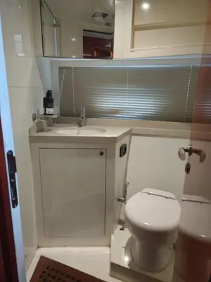 a small bathroom with a toilet and a sink at Luxury yacht Stay Dubai in Dubai
