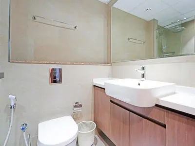 a bathroom with two sinks and a toilet at Contemporary 1 Bedroom in the Heart of Al Furjan-205 in Dubai