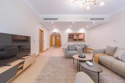a living room with a couch and a table at HAVN - Spacious 2 Bed in Al Hallawi, Palm Jumeirah in Dubai