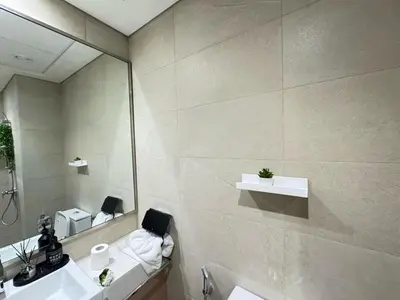 a bathroom with a sink and a mirror at Azizi 26 - Unique Studio for Work and Vacation in Dubai