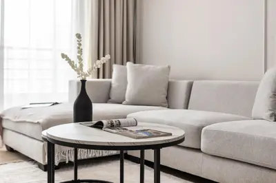 a living room with a couch and a table at 2BR Retreat in the Heart of Dubai Marina by EE Holiday Homes in Dubai