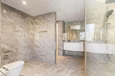 a bathroom with a shower and a toilet at The Smart Concierge - Murjan 5 in Dubai