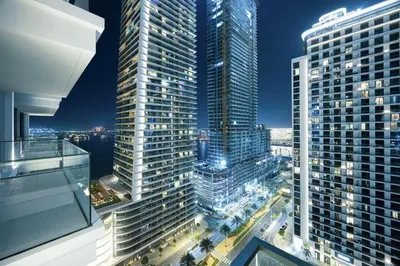 a view of a city at night with tall buildings at Classy Stay at Beach Mansion with Private Beach in Dubai