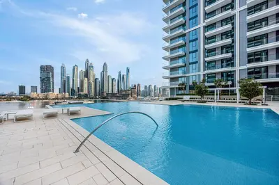 a swimming pool with a city skyline in the background at Classy Stay at Beach Mansion with Private Beach in Dubai