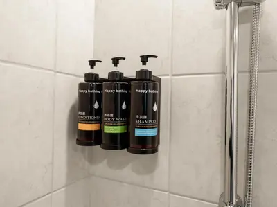 a group of four bottles of wine hanging on a wall at By Luxury Space I Luxury two Bedroom Apartment I Front row Downtown with Private Fountain View in Dubai