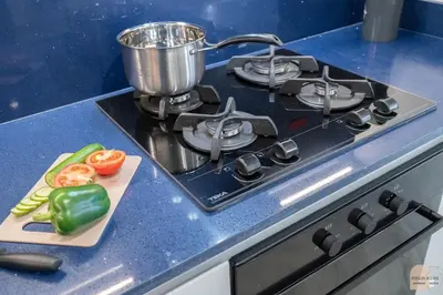 a kitchen stove with a pot on top of it at 35 eme étage panoramique vue mer ,vue Burj Khalifa et Burj el araabe in Dubai