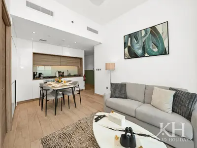 a living room with a couch and a table at keylid Premium 1BR Apartment Dubai Marina in Dubai