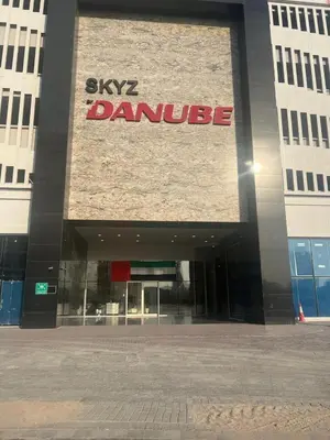 a building with a sign on the front of it at 25 Studio Skyz By Danube, Arjan in Dubai