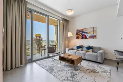 a living room with a couch and a table at Elegant 2Bed Walk to Burj Khalifa & Dubai Mall in Dubai
