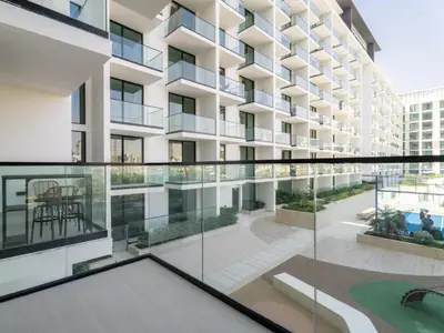an image of an apartment building with glass windows at Modern 1BR Hideaway In Binghatti Phoenix-JVC in Dubai