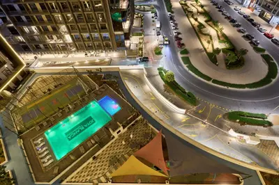 an overhead view of a building with a street at Joya Blanca Residence - Bright 1BR Apartment in Arjan in Dubai