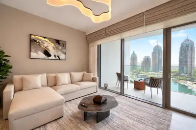 a living room with a couch and a large window at LMY Wharf 2 Marina View Suites - Dubai JBR Marina in Dubai