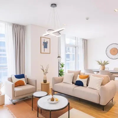 a living room with a couch and a table at Purple Homes, City Walk Apartments in Dubai