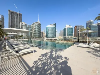 a view of a city with a pool and buildings at Skyview Experience View Burj Khalifa Pool, Canal in Dubai