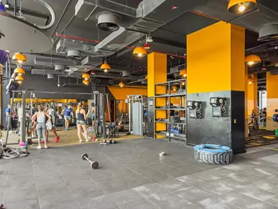 a gym with people walking and people in the background at FIRST CLASS VILLA Zen Luxe Contemporary Haven in Dubai