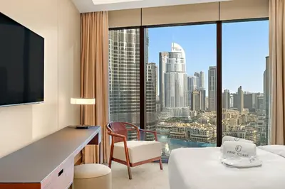 a hotel room with a view of a city at FIRST CLASS 2BR Burj Khalifa & Fountain View in Dubai