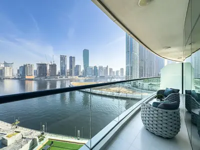 a balcony with a view of the water and a city at Ultra-Luxe Breathtaking Canal Views l Business Bay in Dubai