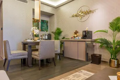 a dining room with a table and chairs at City View Lux 1 BR in Creek Heights Upgraded by UDH in Dubai