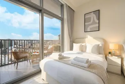 a bedroom with a bed and a large window at Hadley Heights! Pool & Gym Access! 2 Double Bed, Balcony with a Great View! in Dubai