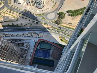 an aerial view of a city with a highway at Brand new Studio in Skyz by Danube Arjan in Dubai