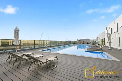 a swimming pool on the roof of a building at Luxury Studio in Dubai Hills by Deleguest in Dubai
