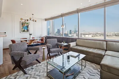 a living room with a couch and chairs at Sky-high luxury in DIFC I new and modern in Dubai