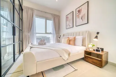 a bedroom with a large bed and a window at Stunning 1 B R in Dubai Hills in Dubai