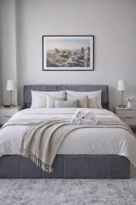a bedroom with a large bed with a blanket at Elegant JVC Studio I Gym Access I Prime Location in Dubai