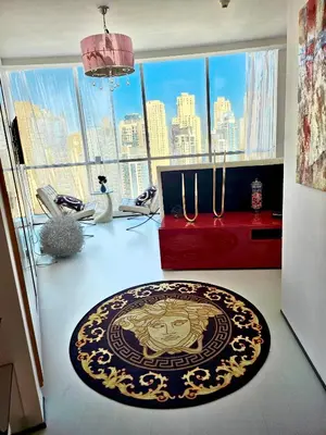 a room with a rug on the floor in front of a large window at Vip guestroom 360 view of marina private terrace with pool in Dubai