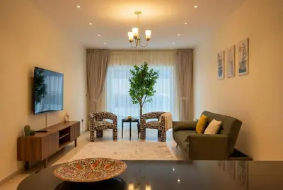 a living room with a couch and a table at High-Floor Marina 1BR Apartment | Skyline Views in Dubai