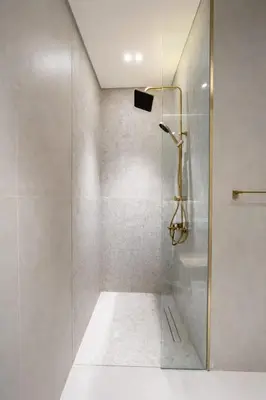 a shower with a glass door in a bathroom at Chic & Peaceful Studio Retreat Binghatti Aurora in Dubai