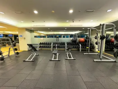 a gym with a lot of equipment and weights at BurjKhalifa l Live show fountain view 3BR Downtown in Dubai