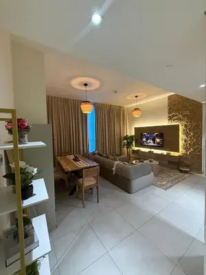 a living room with a couch and a table at Marina bedspace Partial Sea View close to Tram in Dubai