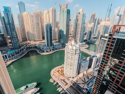 a view of a city with a river and buildings at Quiet Luxury and Views at The Address Dubai Marina in Dubai