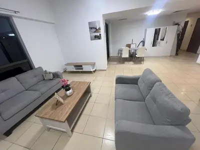 a living room with two couches and a coffee table at Luxury cosy apartment in Dubai