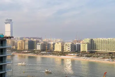 a view of a city with boats in the water at CitiHome - Private Beach Access - Emaar Beachfront in Dubai