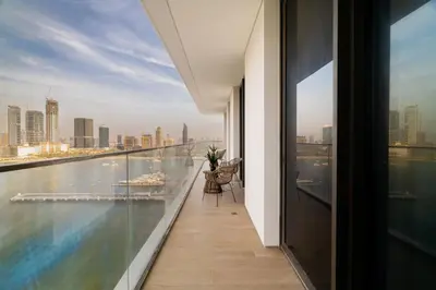 a balcony of a building with a view of the city at CitiHome Elegant 2BR - Private Beach and Marina View in Dubai