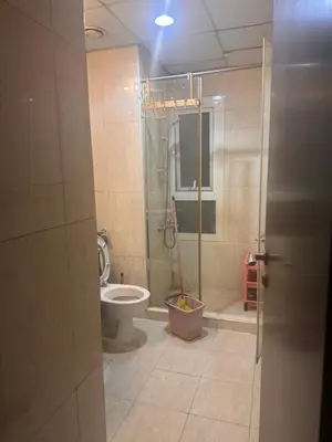 a bathroom with a shower and a toilet at Luxury furnished bed room for VIP family in Dubai