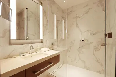 a bathroom with a sink and a shower at 3B in Downtown with Burj Khalifa View Near Dubai Mall and Opera District in Dubai