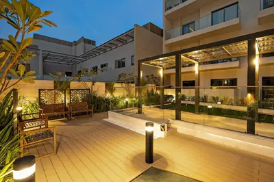 a building with a deck with benches and lights at FIRST CLASS Studio Charming Cozy Comfort in Dubai