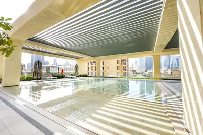 a swimming pool in the middle of a building at very nice apartment in Burj khalifa area downtown in Dubai