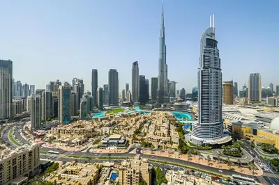 an aerial view of a city with a tall skyscraper at very nice apartment in Burj khalifa area downtown in Dubai